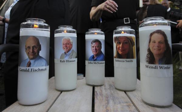 The photos of five people slain in the Capital Gazette newsroom adorn candles at a vigil in June. The attack was mentioned in the analysis of Reporters Without Borders' annual World Press Freedom Index. The photos of five people slain in the Capital Gazette newsroom adorn candles at a vigil in June. The attack was mentioned in the analysis of Reporters Without Borders' annual World Press Freedom Index.