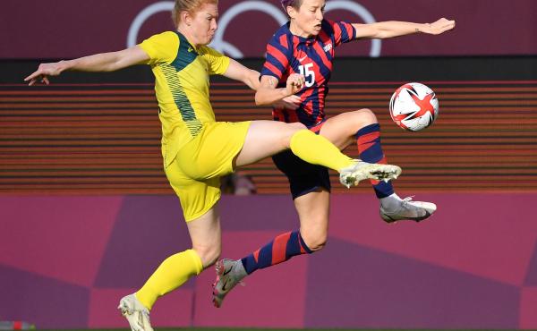 Australia's defender Clare Polkinghorne (left) fights for the ball with Team USA forward Megan Rapinoe during the women's bronze medal soccer match on Thursday at the Tokyo Olympics. Australia's defender Clare Polkinghorne (left) fights for the ball with Team USA forward Megan Rapinoe during the women's bronze medal soccer match on Thursday at the Tokyo Olympics.