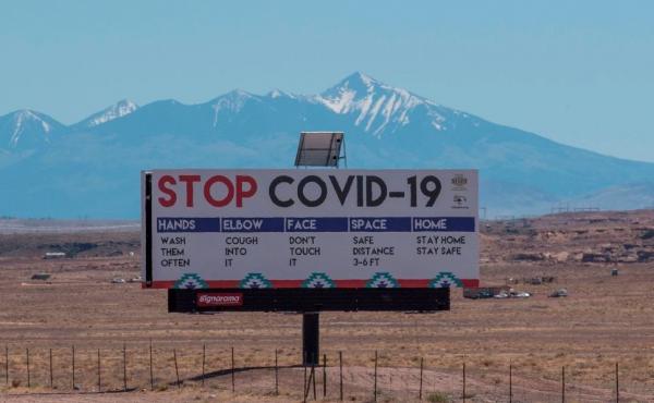 A sign warns against COVID-19 near the Navajo town of Tuba City, Ariz. As the pandemic rages across the U.S., mitigation measures continue to be critical to save lives. A sign warns against COVID-19 near the Navajo town of Tuba City, Ariz. As the pandemic rages across the U.S., mitigation measures continue to be critical to save lives.