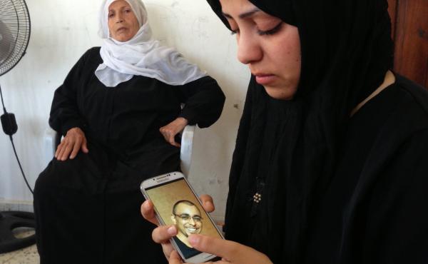 Iman el-Kaas' 33-year-old husband, Anas, was killed last week by an Israeli attack that hit their apartment in the Gaza Strip. She says her husband, a pharmacist, had no ties to Hamas. He is among the nearly 200 killed so far in the current conflict. Iman el-Kaas' 33-year-old husband, Anas, was killed last week by an Israeli attack that hit their apartment in the Gaza Strip. She says her husband, a pharmacist, had no ties to Hamas. He is among the nearly 200 killed so far in the current conflict.