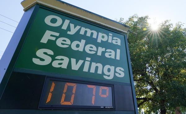 A display at an Olympia Federal Savings branch shows a temperature of 107 degrees Fahrenheit on Monday in the early evening in Olympia, Wash. A display at an Olympia Federal Savings branch shows a temperature of 107 degrees Fahrenheit on Monday in the early evening in Olympia, Wash.