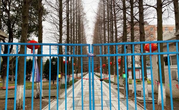 An entrance to a dormitory for Foxconn workers. China's factories normally ramp up production right after the Lunar New Year, but few workers have returned so far this year. An entrance to a dormitory for Foxconn workers. China's factories normally ramp up production right after the Lunar New Year, but few workers have returned so far this year.