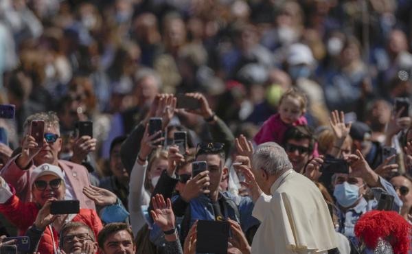 Pope Francis on his popemobile drives through the crowd of faithful at the end of the Catholic Easter Sunday mass he led in St. Peter's Square at the Vatican, Sunday, April 17, 2022. Pope Francis on his popemobile drives through the crowd of faithful at the end of the Catholic Easter Sunday mass he led in St. Peter's Square at the Vatican, Sunday, April 17, 2022.