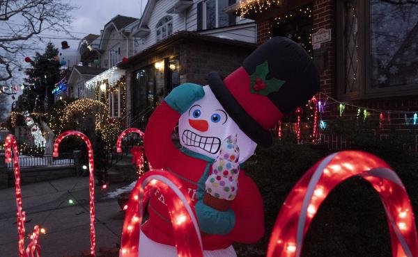 An inflatable snowman and candy canes are part of the decorations that adorn houses in Brooklyn's Dyker Heights neighborhood on Dec. 22, 2020 in New York. A shopping surge by households this year has snarled up global supply chains, and now the race is on An inflatable snowman and candy canes are part of the decorations that adorn houses in Brooklyn's Dyker Heights neighborhood on Dec. 22, 2020 in New York. A shopping surge by households this year has snarled up global supply chains, and now the race is on