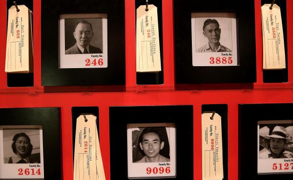 Pictures of people who were incarcerated at Manzanar War Relocation Center are displayed alongside family tags at Manzanar National Historic Site near Independence, Calif., in 2015. Pictures of people who were incarcerated at Manzanar War Relocation Center are displayed alongside family tags at Manzanar National Historic Site near Independence, Calif., in 2015.