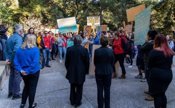 Graduate students marched on Kerr Hall, where the administration offices reside, to deliver their demands to the chancellor on Nov. 7. Watching in the foreground, with their backs to the camera, are Chancellor Cynthia Larive and Executive Vice Chancellor Graduate students marched on Kerr Hall, where the administration offices reside, to deliver their demands to the chancellor on Nov. 7. Watching in the foreground, with their backs to the camera, are Chancellor Cynthia Larive and Executive Vice Chancellor