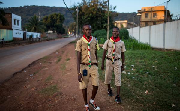 Members of Flambeaux â the evangelical Protestant scouting group â walk along a street in downtown Bangui, Central African Republic. Members of Flambeaux â the evangelical Protestant scouting group â walk along a street in downtown Bangui, Central African Republic.