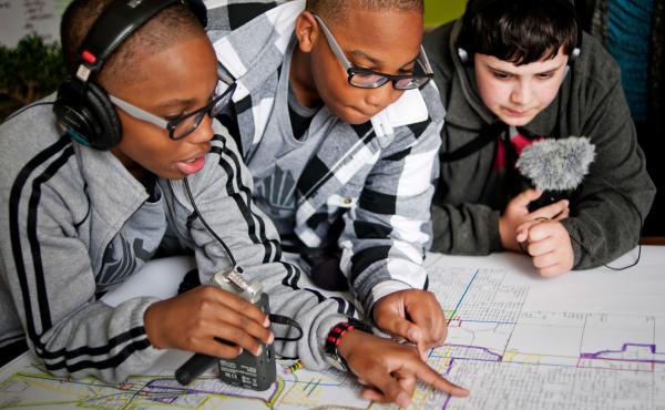 From left, students Erin Addison, Evan Addison and Andrew Arevalo of the Steel City Academy look over a planning map of Gary, Ind. From left, students Erin Addison, Evan Addison and Andrew Arevalo of the Steel City Academy look over a planning map of Gary, Ind.