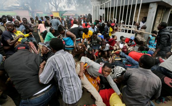 At a distribution of donated food in the Kibera community in Nairobi, there was a stampede as residents rushed for the limited supplies, with several injuries resulting. At a distribution of donated food in the Kibera community in Nairobi, there was a stampede as residents rushed for the limited supplies, with several injuries resulting.