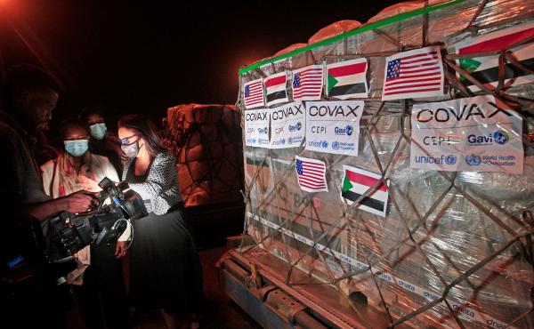 COVID-19 vaccines from COVAX, the international vaccine-sharing program, arrive in Khartoum, Sudan, on Aug. 5. In a letter to President Biden, health experts are asking him to take action to manufacture and distribute vaccines to the entire world. COVID-19 vaccines from COVAX, the international vaccine-sharing program, arrive in Khartoum, Sudan, on Aug. 5. In a letter to President Biden, health experts are asking him to take action to manufacture and distribute vaccines to the entire world.