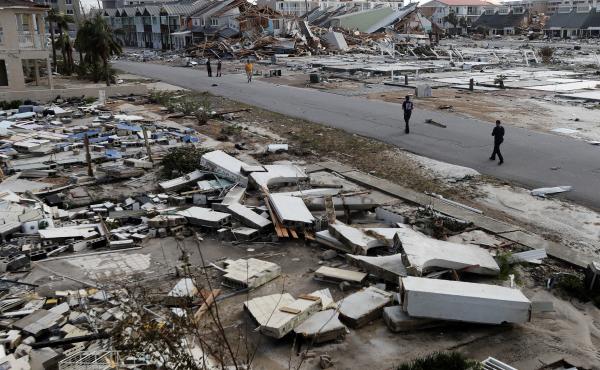 Rescue personnel walk through debris in Mexico Beach, which was devastated by Hurricane Michael. Rescue personnel walk through debris in Mexico Beach, which was devastated by Hurricane Michael.