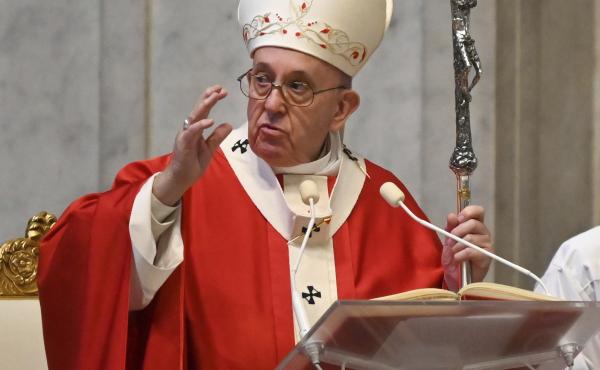 Pope Francis hailed "the saints who live next door" during the COVID-19 pandemic, saying doctors and others who are still working are heroes. The pope is seen here celebrating Palm Sunday Mass behind closed doors in St. Peter's Basilica due to the coronav Pope Francis hailed "the saints who live next door" during the COVID-19 pandemic, saying doctors and others who are still working are heroes. The pope is seen here celebrating Palm Sunday Mass behind closed doors in St. Peter's Basilica due to the coronav