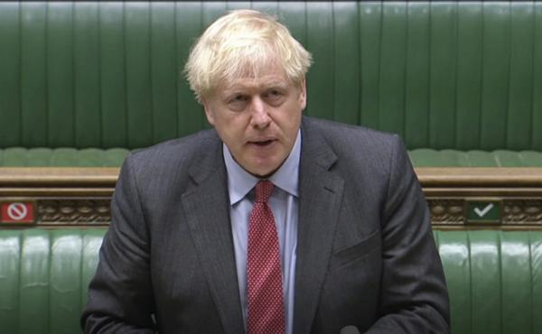 In this image taken from video, British Prime Minister Boris Johnson makes a statement to the House of Commons on the state of the COVID-19 pandemic. In this image taken from video, British Prime Minister Boris Johnson makes a statement to the House of Commons on the state of the COVID-19 pandemic.