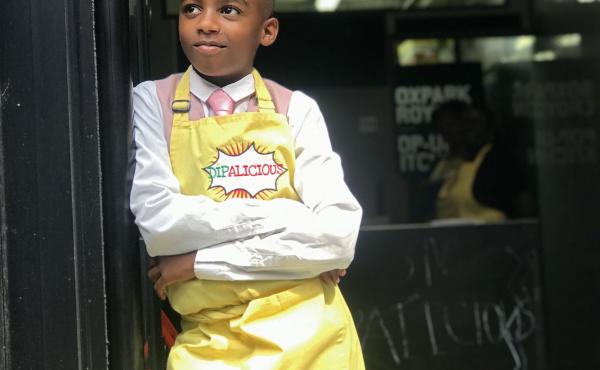 Chef Omari McQueen stands in the doorway of his vegan Caribbean pop-up restaurant Dipalicious. Chef Omari McQueen stands in the doorway of his vegan Caribbean pop-up restaurant Dipalicious.
