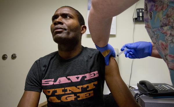Bruno Mbango Enyaka gets his flu shot at a community health center in Portland, Maine, on Jan. 7. Bruno Mbango Enyaka gets his flu shot at a community health center in Portland, Maine, on Jan. 7.