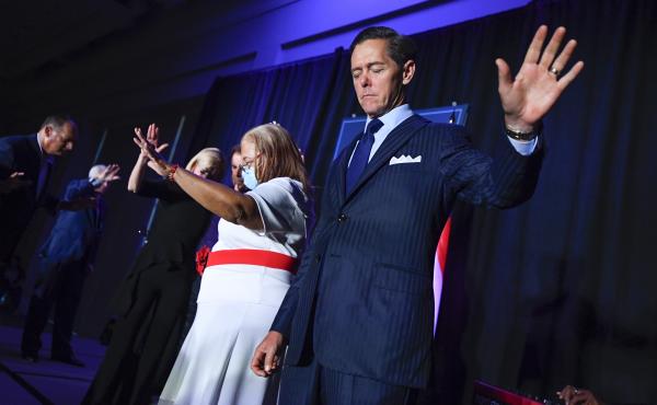Ralph Reed prays on stage during a Donald Trump campaign event courting devout conservatives by combining praise, prayer and patriotism, Thursday, July 23, 2020, in Alpharetta, Ga. Ralph Reed prays on stage during a Donald Trump campaign event courting devout conservatives by combining praise, prayer and patriotism, Thursday, July 23, 2020, in Alpharetta, Ga.