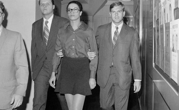 Angela Davis is escorted by two FBI agents after her arrest in New York on Oct. 13, 1970. She was taken from FBI headquarters to the Women's House of Detention. Angela Davis is escorted by two FBI agents after her arrest in New York on Oct. 13, 1970. She was taken from FBI headquarters to the Women's House of Detention.