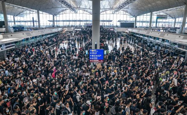Pro-democracy protesters occupy the departure hall of the Hong Kong International Airport, which was closed on Monday. Pro-democracy protesters occupy the departure hall of the Hong Kong International Airport, which was closed on Monday.