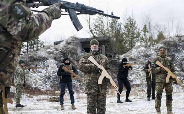 Members of Ukraine's Territorial Defense Forces take part in a Saturday morning training outside Kyiv. New members who have not yet trained with the unit must begin with the basics, and wooden mock weapons, regardless of their experience level. Members of Ukraine's Territorial Defense Forces take part in a Saturday morning training outside Kyiv. New members who have not yet trained with the unit must begin with the basics, and wooden mock weapons, regardless of their experience level.