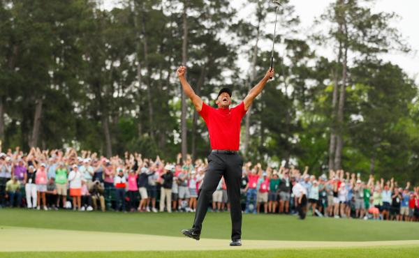 Tiger Woods celebrates after making his putt on the 18th green to win the Masters at Augusta National Golf Club on Sunday in Augusta, Georgia. Tiger Woods celebrates after making his putt on the 18th green to win the Masters at Augusta National Golf Club on Sunday in Augusta, Georgia.