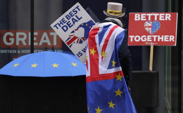 A pro-EU demonstrator sets up banners outside a London conference center, where trade talks were being held on Dec. 4. A pro-EU demonstrator sets up banners outside a London conference center, where trade talks were being held on Dec. 4.