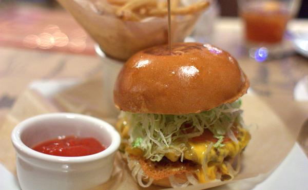 The Big Bite Burger from Guy's American Kitchen and Bar in New York's Times Square. In 2012, New York Times restaurant critic Pete Wells penned an infamous takedown of the restaurant. The Big Bite Burger from Guy's American Kitchen and Bar in New York's Times Square. In 2012, New York Times restaurant critic Pete Wells penned an infamous takedown of the restaurant.
