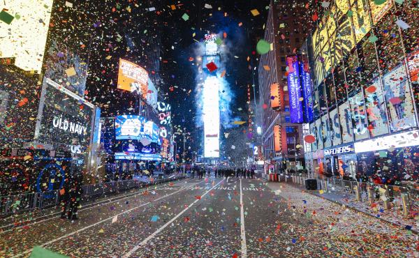 Confetti falls at midnight during a virtual New Year's Eve celebration in New York City's Times Square on Jan. 1, 2021. The annual New Year's Eve ball drop event, which typically draws more than 1 million people, was closed to the public due to the COVID- Confetti falls at midnight during a virtual New Year's Eve celebration in New York City's Times Square on Jan. 1, 2021. The annual New Year's Eve ball drop event, which typically draws more than 1 million people, was closed to the public due to the COVID-