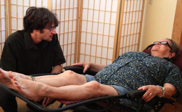 Doris Keene (right) talks with her acupuncturist before a treatment at Portland's Quest Center for Integrative Health. Keene says the treatments have eased her chronic back pain at least as effectively as the Vicodin and muscle relaxants she once relied o Doris Keene (right) talks with her acupuncturist before a treatment at Portland's Quest Center for Integrative Health. Keene says the treatments have eased her chronic back pain at least as effectively as the Vicodin and muscle relaxants she once relied o