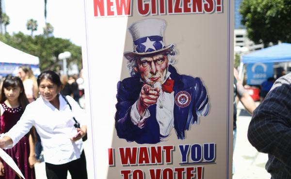 A sign encourages newly sworn-in U.S. citizens to register to vote outside a naturalization ceremony in 2019 in Los Angeles. After failing to get the now-blocked citizenship question on the 2020 census, the Trump administration is continuing to gather gov A sign encourages newly sworn-in U.S. citizens to register to vote outside a naturalization ceremony in 2019 in Los Angeles. After failing to get the now-blocked citizenship question on the 2020 census, the Trump administration is continuing to gather gov