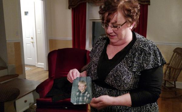 Toni Hoy, at her home in Rantoul, Ill., holds a childhood photo of her son, Daniel, who is now 24. In a last-ditch effort to get Daniel treatment for his severe mental illness in 2007, the Hoys surrendered parental custody to the state. "When I think of h Toni Hoy, at her home in Rantoul, Ill., holds a childhood photo of her son, Daniel, who is now 24. In a last-ditch effort to get Daniel treatment for his severe mental illness in 2007, the Hoys surrendered parental custody to the state. "When I think of h