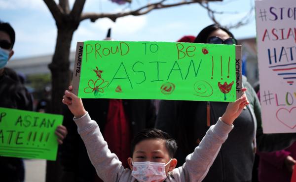 A boy holding a sign takes part in a Stop Asian Hate rally in Oakland, Calif. A boy holding a sign takes part in a Stop Asian Hate rally in Oakland, Calif.