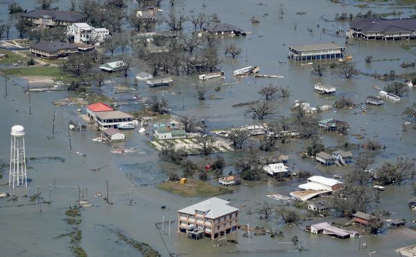 Buildings and homes were flooded after Hurricane Laura hit near Lake Charles, La., in August. Five named storms came ashore in Louisiana in 2020 — part of a record-setting Atlantic hurricane season. Buildings and homes were flooded after Hurricane Laura hit near Lake Charles, La., in August. Five named storms came ashore in Louisiana in 2020 — part of a record-setting Atlantic hurricane season.