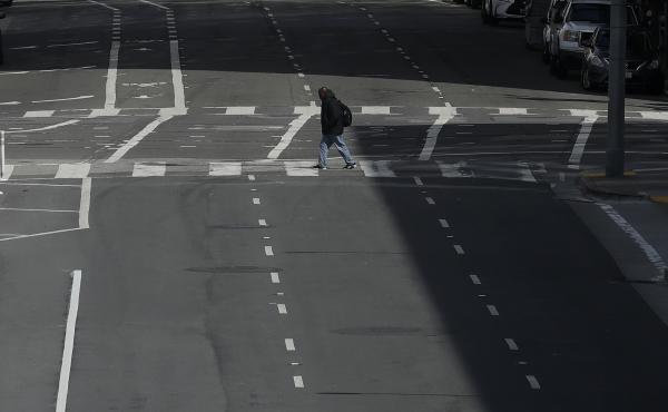 A man crosses a nearly empty street in San Francisco, on March 17, 2020. Despite a reduction in driving last year, road fatalities increased, according to the National Safety Council. A man crosses a nearly empty street in San Francisco, on March 17, 2020. Despite a reduction in driving last year, road fatalities increased, according to the National Safety Council.