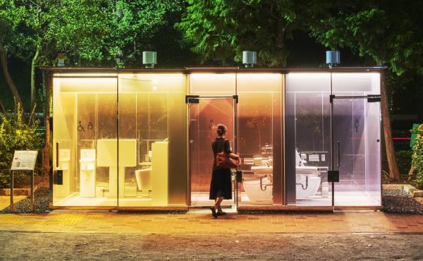 A woman enters a public restroom with transparent walls in Tokyo's Shibuya ward. Architect Shigeru Ban designed the bathroom in a way to reassure anyone entering the toilet. A woman enters a public restroom with transparent walls in Tokyo's Shibuya ward. Architect Shigeru Ban designed the bathroom in a way to reassure anyone entering the toilet.