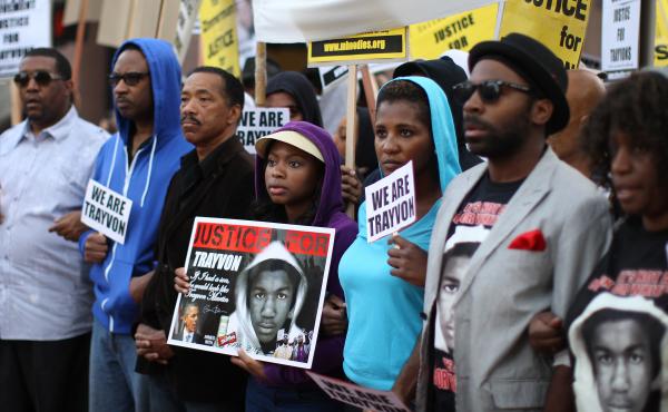 People in Los Angeles walk in a silent protest march on April 9, 2012, to demand justice for the killing of Trayvon Martin. People in Los Angeles walk in a silent protest march on April 9, 2012, to demand justice for the killing of Trayvon Martin.