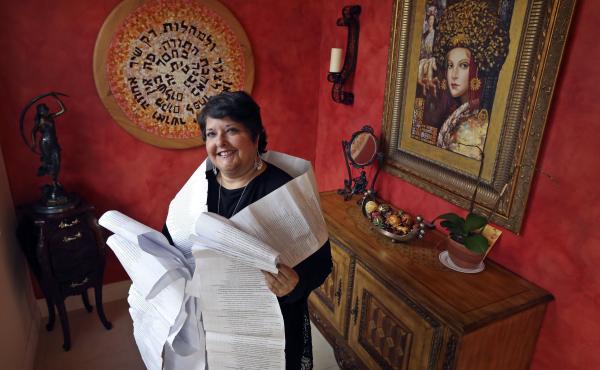 Genie Milgrom, pictured in 2013, stands in the entryway of her Miami home wrapped in a long family tree, filled with the names of 22 generations of grandmothers. Raised Catholic, Milgrom traced her family's hidden Jewish roots with the help of a trove of Genie Milgrom, pictured in 2013, stands in the entryway of her Miami home wrapped in a long family tree, filled with the names of 22 generations of grandmothers. Raised Catholic, Milgrom traced her family's hidden Jewish roots with the help of a trove of