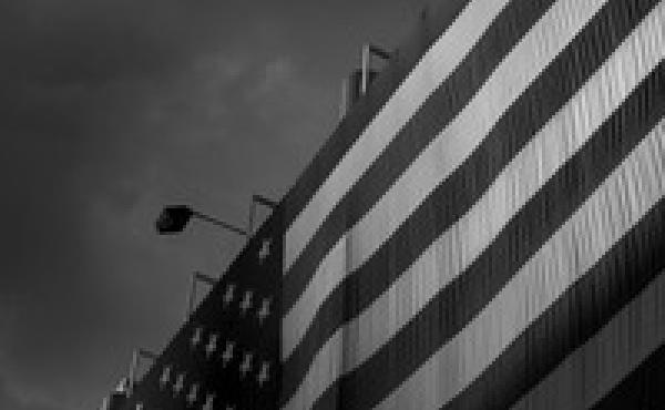 Light falls on the American flag at the Quicken Loans Arena in Cleveland. Light falls on the American flag at the Quicken Loans Arena in Cleveland.