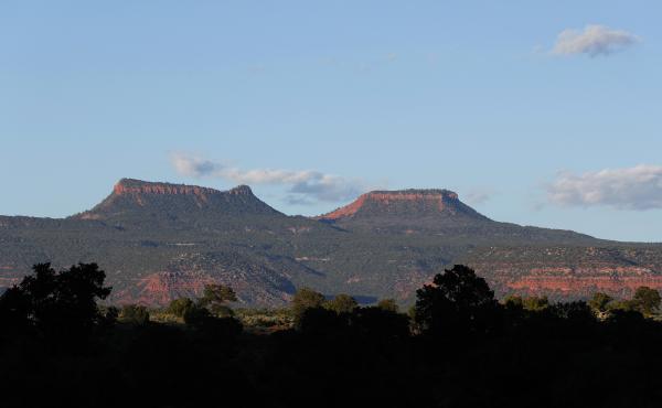 The two bluffs that inspired the name of the Bears Ears National Monument, seen at sunset outside Blanding, Utah. On Thursday, more than two years after the Trump administration announced plans to shrink the monument and others, federal managers have fina The two bluffs that inspired the name of the Bears Ears National Monument, seen at sunset outside Blanding, Utah. On Thursday, more than two years after the Trump administration announced plans to shrink the monument and others, federal managers have fina
