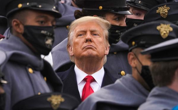 Surrounded by Army cadets, President Trump watches the Army-Navy football game at the U.S. Military Academy in West Point, N.Y., on Dec. 12. Surrounded by Army cadets, President Trump watches the Army-Navy football game at the U.S. Military Academy in West Point, N.Y., on Dec. 12.