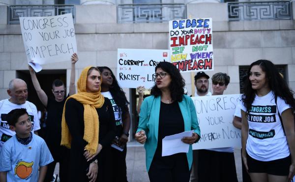 Rep. Rashida Tlaib, D-Mich., joins activists asking for impeachment of President Trump on Capitol Hill on Monday. Rep. Rashida Tlaib, D-Mich., joins activists asking for impeachment of President Trump on Capitol Hill on Monday.