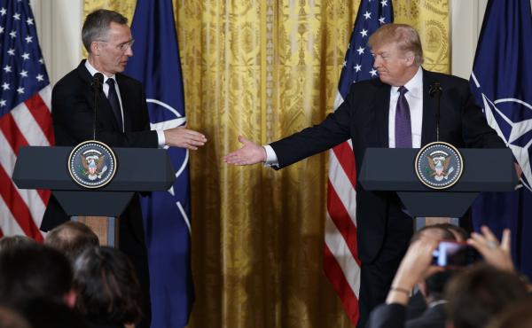 President Trump reaches to shake hands with NATO Secretary General Jens Stoltenberg during a news conference in the East Room of the White House on Wednesday. President Trump reaches to shake hands with NATO Secretary General Jens Stoltenberg during a news conference in the East Room of the White House on Wednesday.