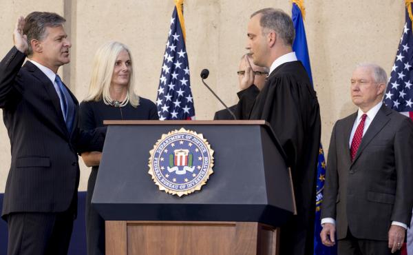 FBI Director Chris Wray, accompanied by his wife, Helen Garrison Howell, FBI Deputy Director Andrew McCabe and Attorney General Jeff Sessions, is administered the ceremonial oath of office by U.S. District Judge Joseph Bianco during Thursday's installatio FBI Director Chris Wray, accompanied by his wife, Helen Garrison Howell, FBI Deputy Director Andrew McCabe and Attorney General Jeff Sessions, is administered the ceremonial oath of office by U.S. District Judge Joseph Bianco during Thursday's installatio