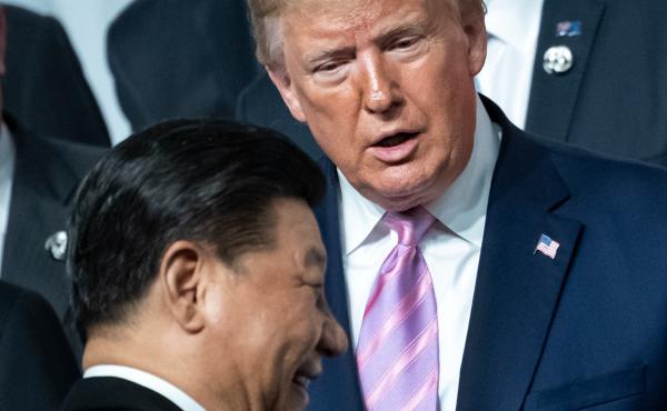 China's President Xi Jinping and President Trump chat as they pose for the group photo at the beginning of the G-20 summit in Osaka, Japan, in June. Trump has offered to meet with Xi about resolving protests in Hong Kong. China's President Xi Jinping and President Trump chat as they pose for the group photo at the beginning of the G-20 summit in Osaka, Japan, in June. Trump has offered to meet with Xi about resolving protests in Hong Kong.