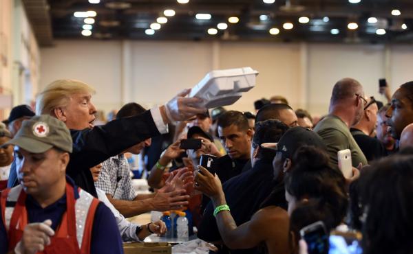 President Trump serves food to Hurricane Harvey victims at NRG Center in Houston, Texas, on Saturday. President Trump serves food to Hurricane Harvey victims at NRG Center in Houston, Texas, on Saturday.