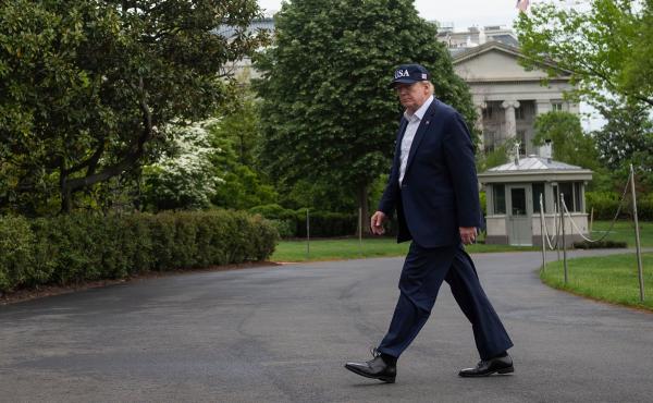 President Trump walks to the White House on Sunday, after returning from Camp David in Maryland. President Trump walks to the White House on Sunday, after returning from Camp David in Maryland.