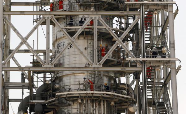 Workers fix damage at Saudi Aramco's Khurais oil field in Saudi Arabia on Friday after it was hit during a Sept. 14 attack. Workers fix damage at Saudi Aramco's Khurais oil field in Saudi Arabia on Friday after it was hit during a Sept. 14 attack.