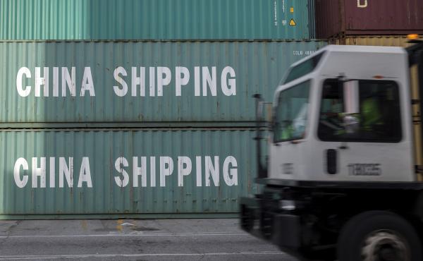 A truck passes a stack of Chinese shipping containers at the Port of Savannah in Georgia in July. A truck passes a stack of Chinese shipping containers at the Port of Savannah in Georgia in July.