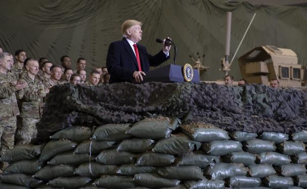 President Trump speaks to U.S. troops at Bagram Airfield, Afghanistan, on Thanksgiving Day 2019. The Trump administration says it's cutting U.S. forces from 4,500 to 2,500 troops in Afghanistan, one of several abrupt military moves announced recently. President Trump speaks to U.S. troops at Bagram Airfield, Afghanistan, on Thanksgiving Day 2019. The Trump administration says it's cutting U.S. forces from 4,500 to 2,500 troops in Afghanistan, one of several abrupt military moves announced recently.