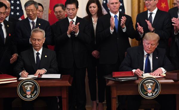 President Trump and Vice Premier Liu He, China's top trade negotiator, sign a "Phase 1" trade agreement between the U.S. and China at the White House on Wednesday. President Trump and Vice Premier Liu He, China's top trade negotiator, sign a "Phase 1" trade agreement between the U.S. and China at the White House on Wednesday.