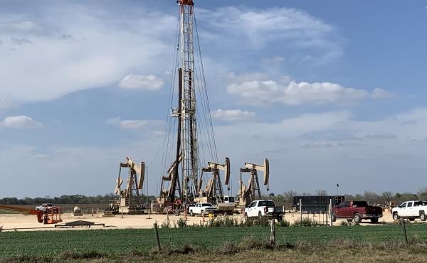 A crew near Karnes City, Texas, continued work as oil prices collapsed this week. Companies already were cutting costs and now will have to cut deeper as oil prices remain low. A crew near Karnes City, Texas, continued work as oil prices collapsed this week. Companies already were cutting costs and now will have to cut deeper as oil prices remain low.